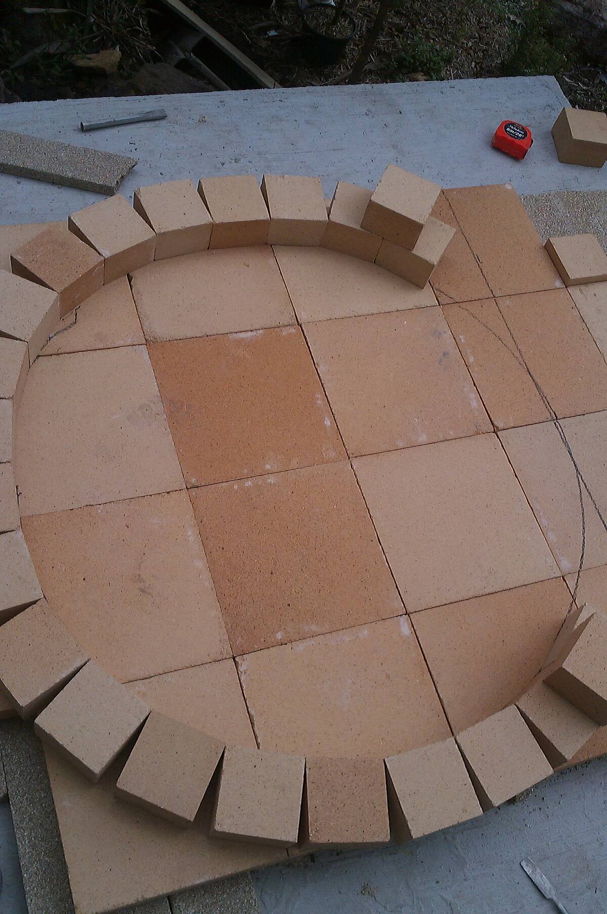 Firebrick oven floor laid in a circle before the dome is built