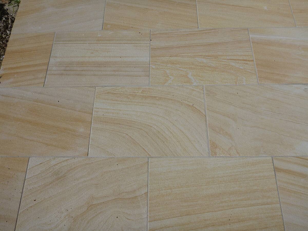 Detail of sawn sandstone paving with natural banding