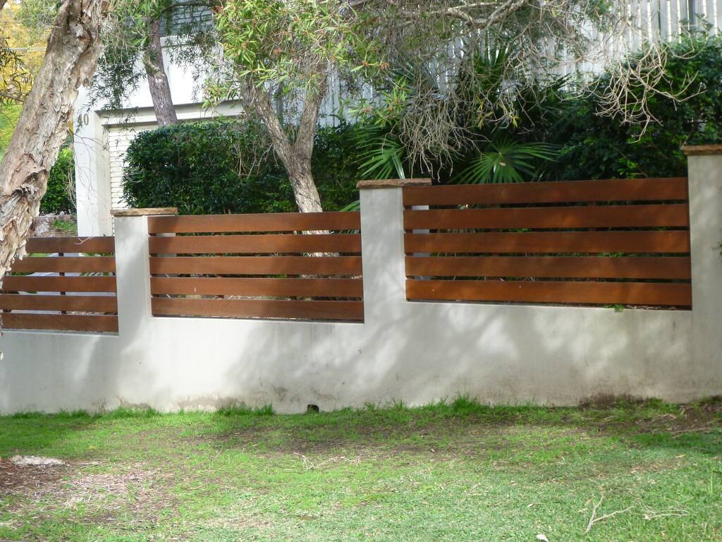 Hardwood slat screen on a rendered masonry wall