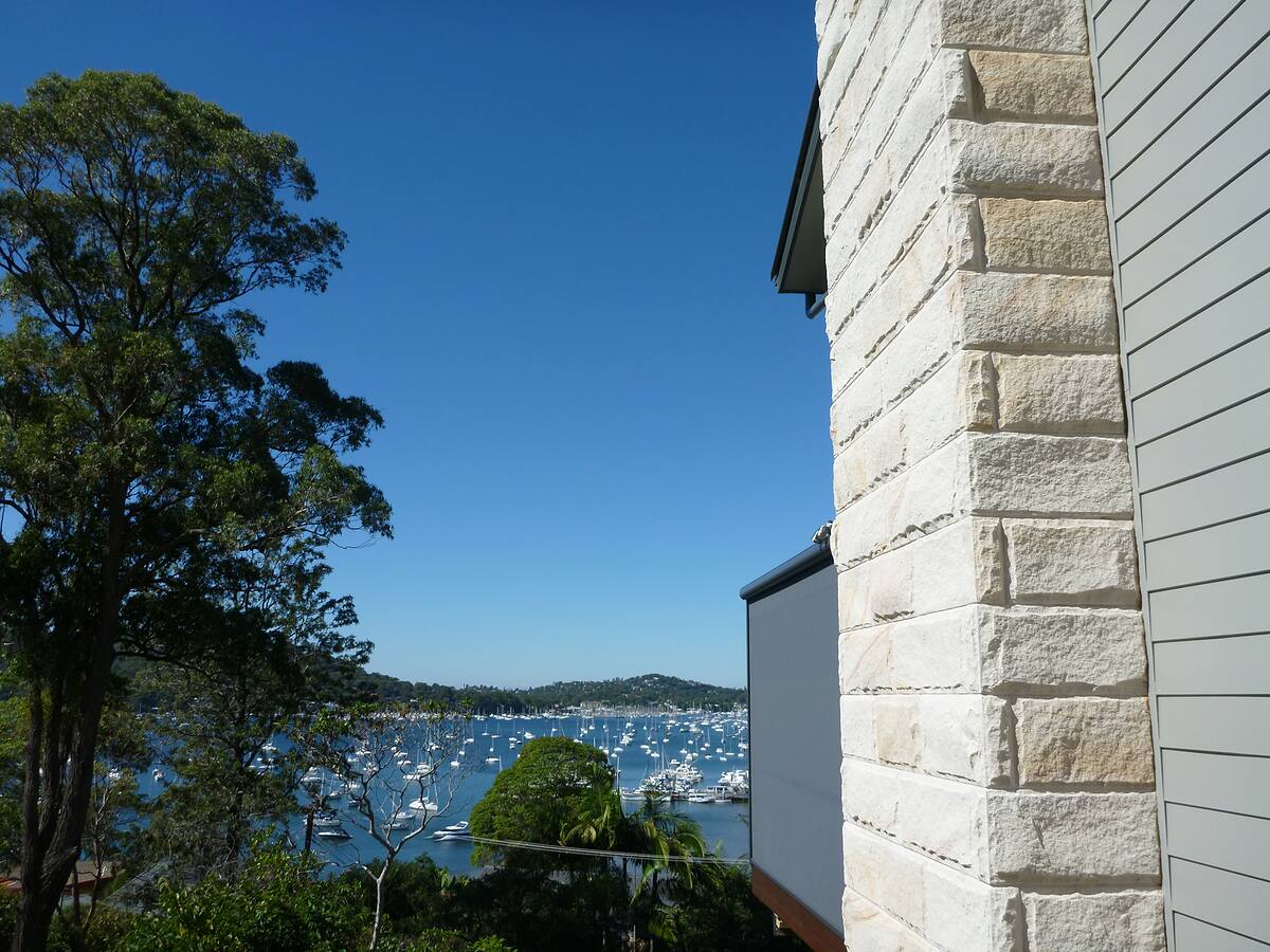 Sandstone-clad chimney overlooking Pittwater on the Northern Beaches
